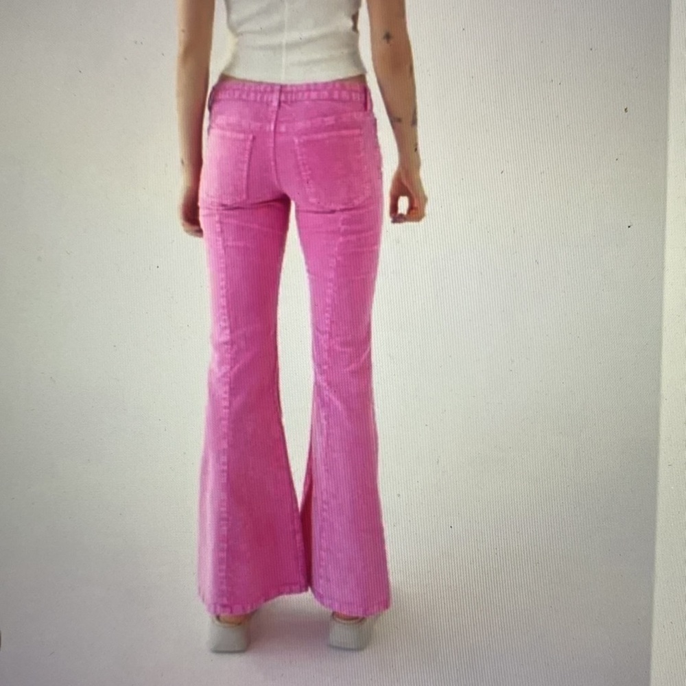 BDG Bright pink low rise flare jeans, size 25